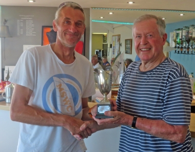 Malcolm Jolly presents the Laser Class Trophy to Jono Dunnett
