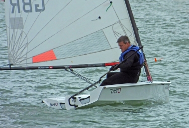 Ken Potts glances at his watch as he approaches the start line