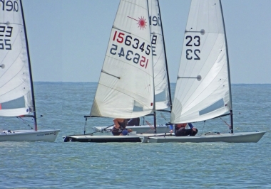 Finley Taylor holds off his immediate competitors in his Laser