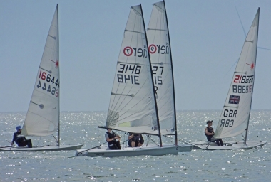 Adam Kedge and Jono Dunnett in their Lasers put the squeeze on Andy Cornforth and Tim Dye in their RS Aeros