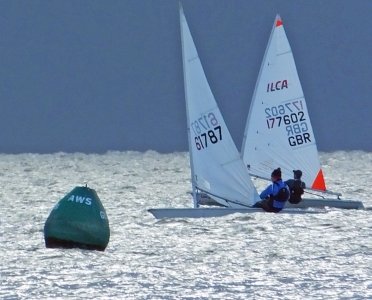 Arlo Atkins beats to the AWS buoy in his Laser