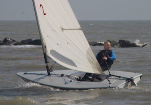 Paul Stanton checks it is all clear before tacking his Laser away from the shore