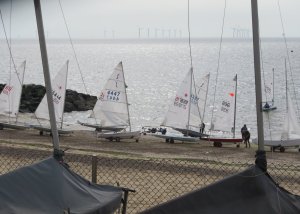 Competitors' boats sit on the beach ready for action