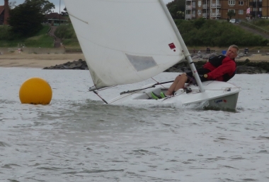 Catching a sudden gust of wind - Brian Allen in his Laser