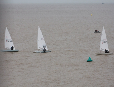 Paul Stanton leads Tim Dye, then Robert Mitchell in the Laser race