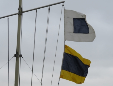 The Laser Shorten Course flags fly after two laps