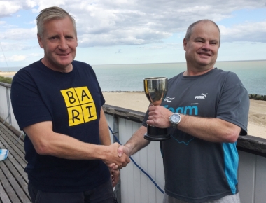 Paul Stanton (right) receives the Double Dan Trophy from last year's winner Brian Allen