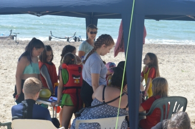 Those on shore enjoy games on the beach