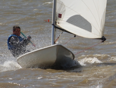 Ken Potts powers-up his Laser during the race