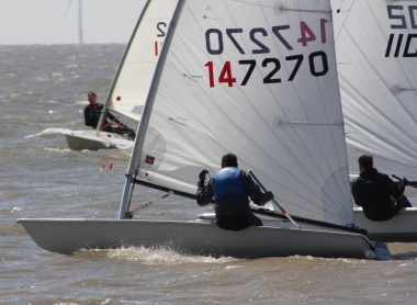 Ken Potts and John Tappenden get underway on port tack whilst Robert Mitchell bears-down on them on starboard tack