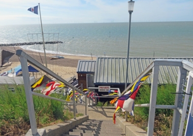 Colourful code flags greet the visitors and members