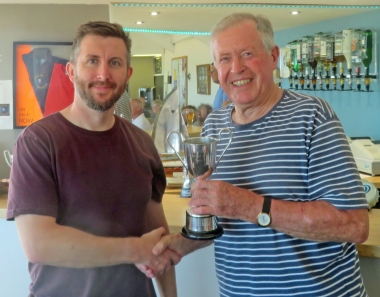 Gunfleet's Andy Cornforth is presented with the Diamond Jubilee Trophy by Malcolm Jolly