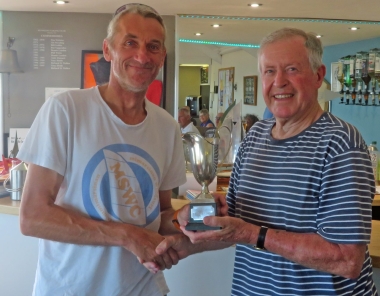 Malcolm Jolly presents the Laser Class Trophy to Jono Dunnett