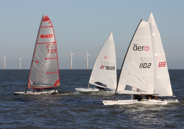 John Heath, in his Blaze, leading Andy Dunnett and Brian Allen in their Lasers, and John Tappenden's RS Aero