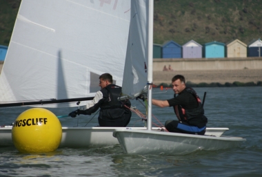 John Tappenden rounds the Kingscliff buoy in his Laser, just ahead of Ken Potts