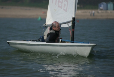 Paul Stanton concentrating, or possibly taking it easy, in his Laser