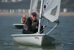 Eddie White, in his new Laser, looking pleased to be back on the water