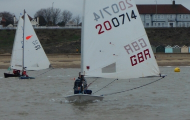 It's still quite a close call round the Kingscliff buoy with Paul Stanton, in his Laser, ahead of Peter Downer's Comet and Dave Fowell's Solo