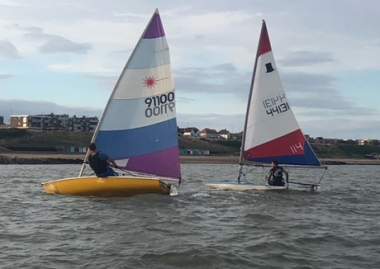 Carlo Bardetti in his Laser and Adam Kedge in the Topper