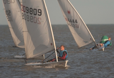 Ken Potts leads in his Laser, with John Tappenden's RS Aero, and Jono Dunnett's Laser just behind