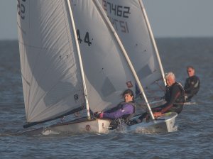 Clare Giles keeps her Europe flat and holds off Andy Dunnett and Robert Mitchell in their Lasers