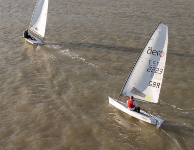 Brian Allen, in his Laser, leads Dave Ingle in his RS Aero