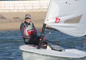 Yvonne Gough maintaining second place for much of the race, in her Laser