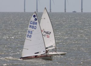 Robert Mitchell's Laser to windward of Clare Giles's Europe on the first leg of the Toppo Single Helm race