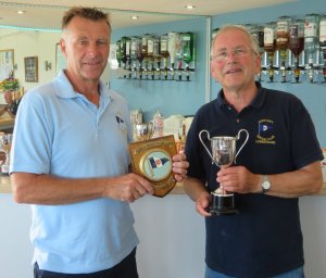 John Tappenden receives the Diamond Jubilee Trophy, and keepsake shield, from Club Commodore Richard Walker