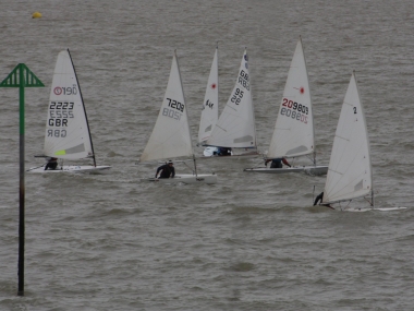 The leading boats of Clare Giles, Ken Potts, and Robert Mitchell as the second start gets underway