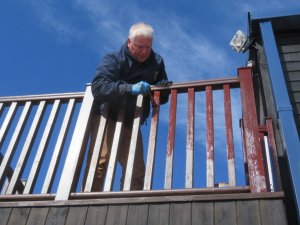 Ian sets-to, refurbishing the veranda