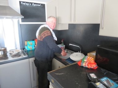 Washing-up after lunch prepared by the ladies