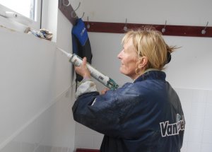 Lesley cracks-on with the internal repairs to the changing rooms