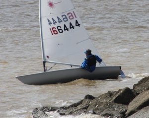 Jono Dunnett tacks close to a fishtail groyne in the first race