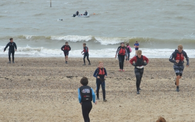 The first swimmer heads out to the Rescue Boat as the Team Bucket is full