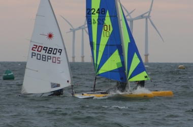 Robert Mitchell and Paul Stanton power their Dart 16 up and fly past Ken Potts, in his Laser, at the start