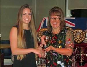 Cadet Beth Elliott receives the Austin Ladies Trophy from Rear Commodore Helen Swinbourne