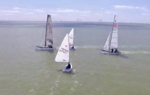 Cutting through the catamarans, taking part in the Three Piers Race, Dunnett at this point had a good lead