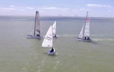 Cutting through the catamarans, taking part in the Three Piers Race, Dunnett at this point had a good lead