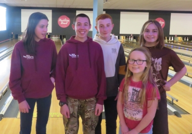 Laura, Adam, Finley, Poppy and Belle relax after bowling at the Pavilion