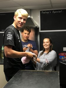Cadet Rear Commodore Tom Philpot and Cadet Commodore Harry Swinbourne asking Daisy not to spill the beans about washing-up during the Gunfleet Chill-Out Evening!