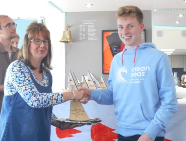 Championship Winner Chris Hatton is presented with his trophy by Gunfleet Rear Commodore Helen Swinbourne