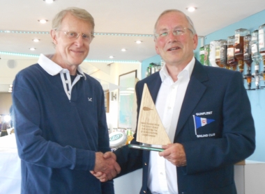 Comet Class Association Chair John Sturgeon presents Gunfleet Commodore Richard Walker with a memento of the event