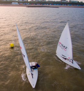  Andy Dunnett and Yvonne Gough, having just rounded the Eastcliff buoy battle it out in the Wednesday evening Summer Series race