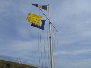 The signal flags fly briskly, with just over 1 minute to the start