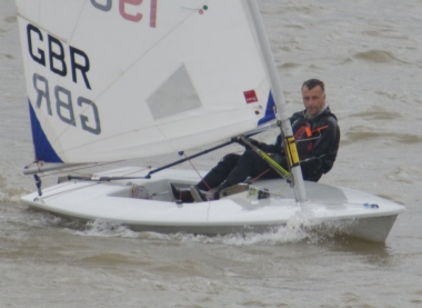 With the mainsheet cranked down, block to block, John Tappenden keeps up the pressure in his Laser