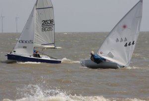 Andy Dunnett in his Laser, battles it out with his sons Jono and Gregg in their Laser 2000