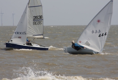 Andy Dunnett in his Laser, battles it out with his sons Jono and Gregg in their Laser 2000