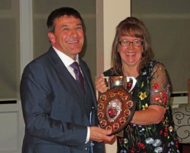 It's all smies as Ken Potts picks-up just some of the many trophies he was awarded for his sailing prowess in 2017