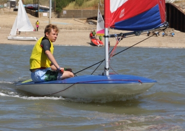 Cadet Korben Symmonds sailing his Topper into third place in the first race of the Cadet Class Points series